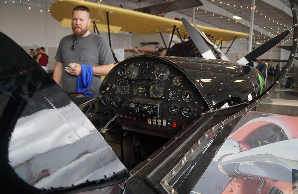 Small plane cockpit with lots of dials and gauges.